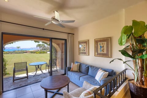 Relaxing lounge with sofa and direct access outside.