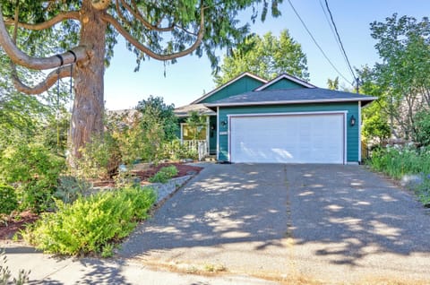 2 parking spaces in the driveway. EV charger to the right.