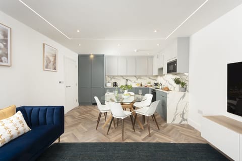 View of Kitchen and dining area, with the fridge, freezer, oven and microwave - 2 Oasis Sands
