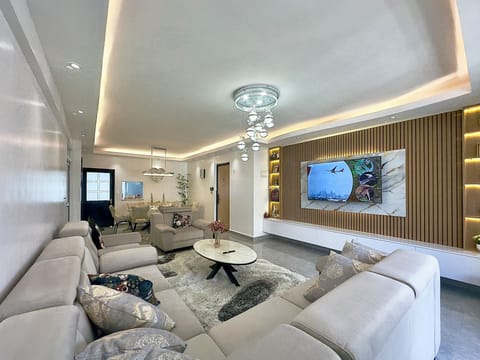Very spacious livingroom with 7 seater sofaset from europe