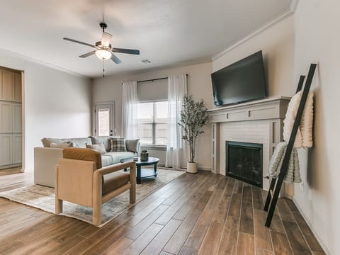 Open living area with comfortable seating and smart TV