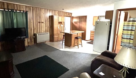 Large kitchen with island for meals or games.