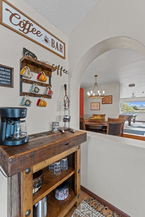 Modern and efficient—everything you need to create a delicious meal. The kitchen features a stainless steel refrigerator, stove, coffee maker, kitchenette oven, kettle, and blender.