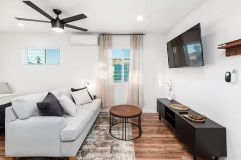 Relax in our modern living room featuring a stylish sofa &  smart TV
