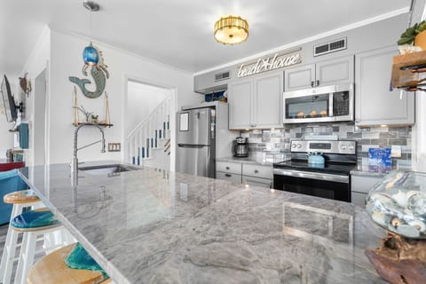 Kitchen: Bright and inviting space with stylish decor, perfect for culinary adventures!