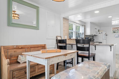 Dining Nook: Enjoy meals surrounded by beachy decor and natural light in this charming space!