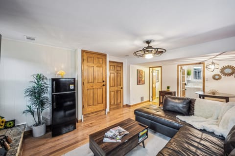 Main floor living room with pull out queen couch and half bath.