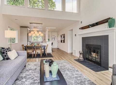 Living room looking toward kitchen. upper windows give the condo amazing light.