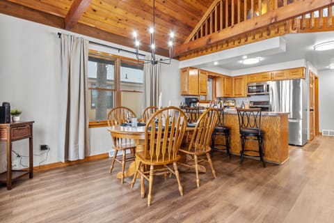 The open-concept design seamlessly connects the living, dining, and kitchen areas, creating a bright and inviting space.