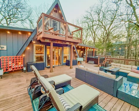 800 sf Deck | Fire table | Outdoor Cooler | Gas Grill (Propane Provided) | Private Hot Tub | Tons of Outdoor Games | Private Wooded Views | String Lights