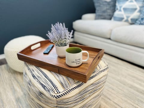 Living room for social gatherings that’s open to the kitchen and dining room.