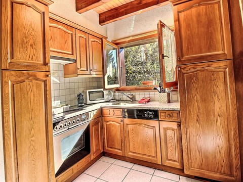 Kitchen, Cabinetry, Kitchen Appliance, Major Appliance, Countertop, Wood, Interior Design, Flooring, Kitchen Sink, Cupboard