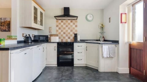 Modern shaker style kitchen with attached dining area 