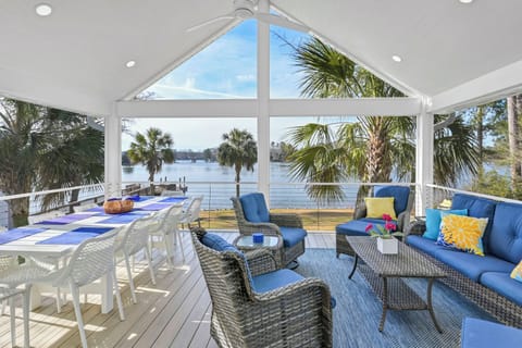 Screened-in porch with dining for 10 and separate seating area 
