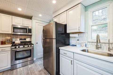 Bright and cozy kitchen with modern stainless steel appliances