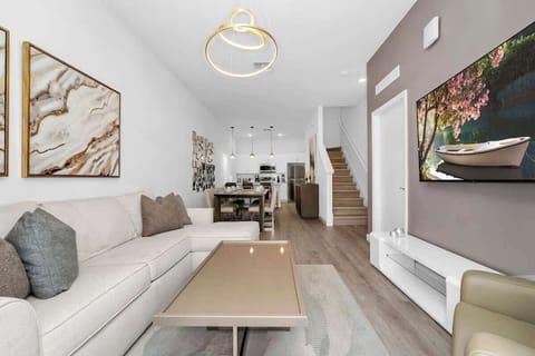 Spacious and cozy living room with plush seating and a Smart TV for ultimate relaxation!