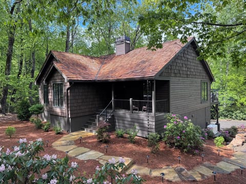 Front of the house.  Has front porch with rocking chairs and lighted walkway