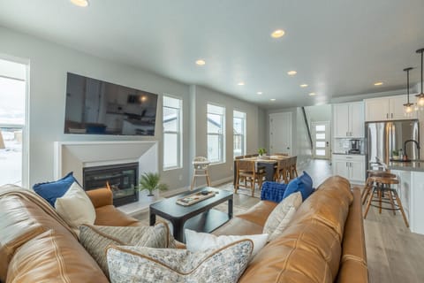 Spacious open-concept living with a cozy fireplace.