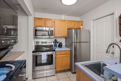 Fully stocked kitchen with access to back yard and dishwasher. 
Kitchen is stocked to start your stay with trash bags, sponge, dish soap, dish detergent, laundry soap, paper towels and coffee!