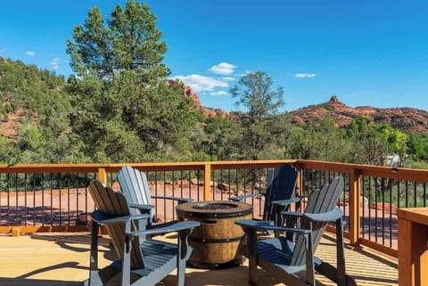 Scenic front porch views and an outdoor fire pit for evening relaxation.