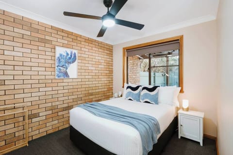Drift off into a restful night in the second bedroom, where a double bed with soft linens offers a peaceful retreat.