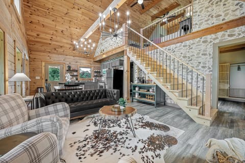 Living room with comfortable seating and updated furnishings.