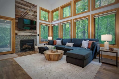 Great room with fireplace, HD TV and vaulted ceilings