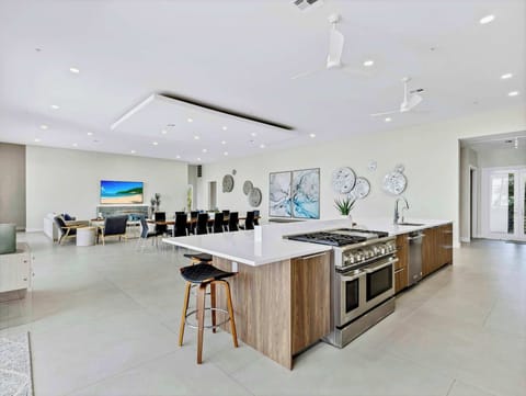 Kitchen with oversized island capable of seating 10 and Wolf/Sub Zero Appliances
