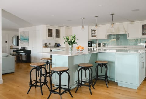 Heron House, Newquay. First floor: Kitchen with expansive marble breakfast island providing seating for six guests