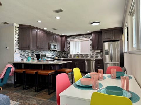 Kitchen: This kitchen invites you to stay in and savor the moment. The perfect spot for family meals or friendly chats.