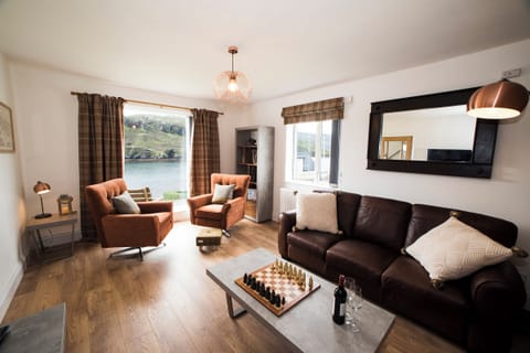 Living Room with a view over  West Loch and a Real Flame Fire to cosy up to.