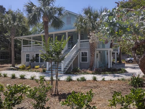 Walk to the beautiful beach from this
lovely home with a hugh covered front
porc