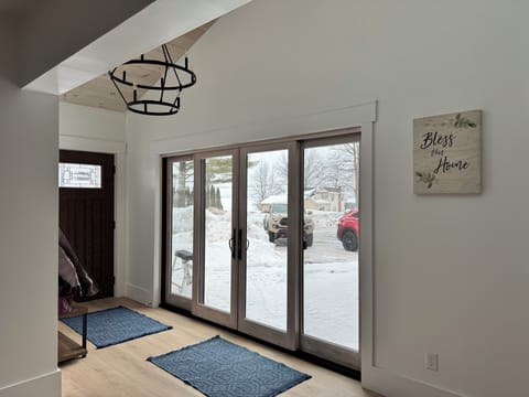 Sliding glass doors to enjoy the view of the lake from the front deck!