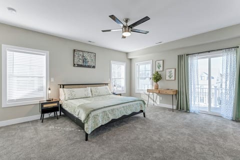 Spacious primary bedroom with TV 
