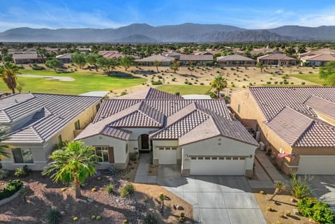 House located on the beautiful golf course with surrounding mountain views 