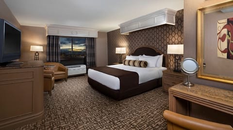Sink into plush bedding and relax with evening city views.