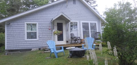 view of firepit and deck from the dock