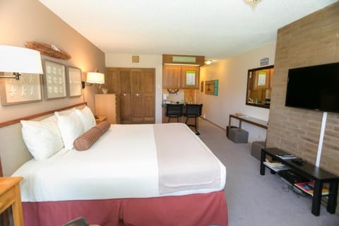 Settle into crisp linens with TV and desk convenience nearby.