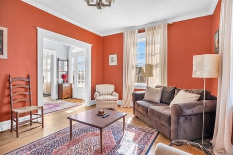 Living Room: Bright and inviting space with vibrant walls and stylish decor for relaxing moments!
