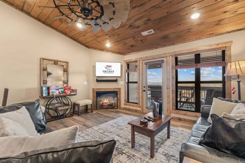 Spacious Living Area with Deck Access, Cable TV, Seasonal Fireplace, and Games.