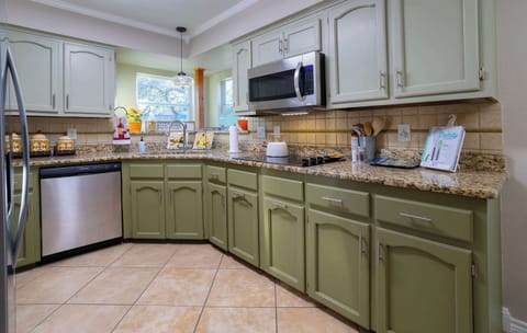 The open kitchen offers ample space & all the comforts of home