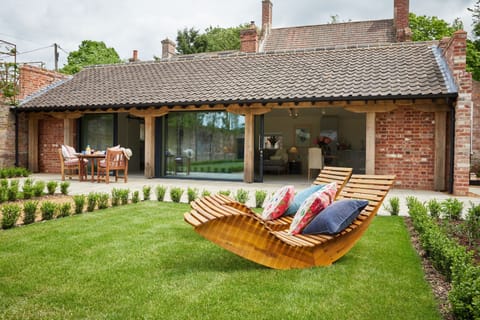The sunny private garden outside The Garden House