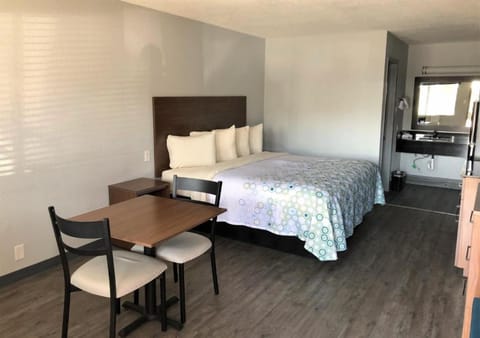 Sip coffee at the table before sinking into soft bedding.