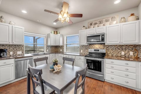 Full size kitchen on the 3rd Floor with dishwasher, stove, microwave, frig