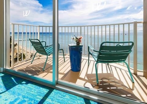 Sip morning coffee on the balcony overlooking shimmering blue water.