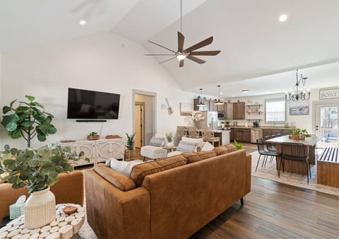 Open concept with living room, kitchen, and dining area