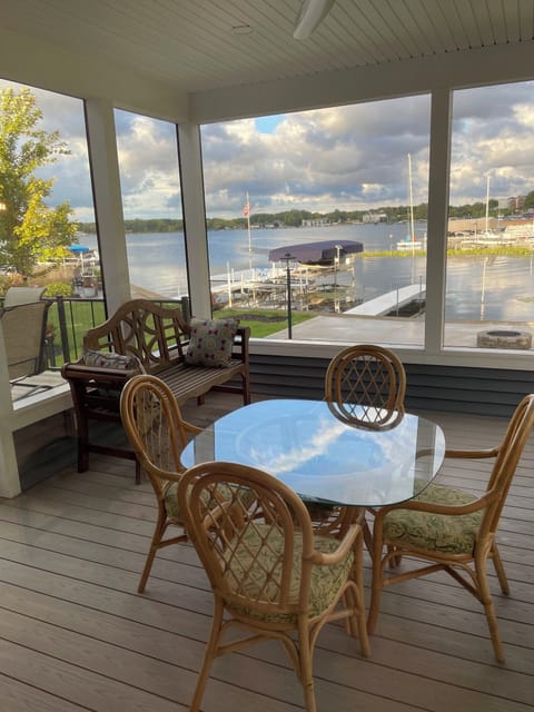 Screened in porch with amazing view of Lake Wawasee.
