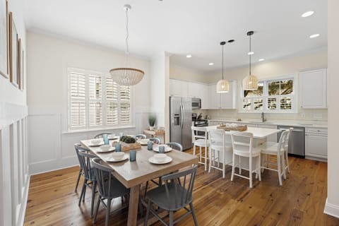 Dining table and kitchen- plenty of seating for your guests.