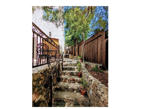 Enter the property by walking up a mason artist's rock wall and stairs.