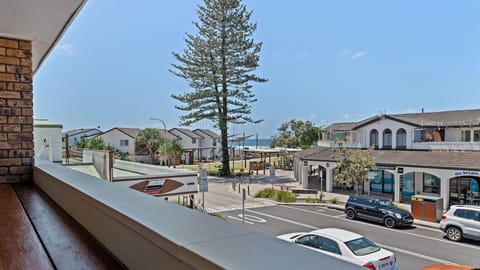 Private balcony with view over the park to the ocean. Sit up bar to enjoy the view with drinks and food. 
